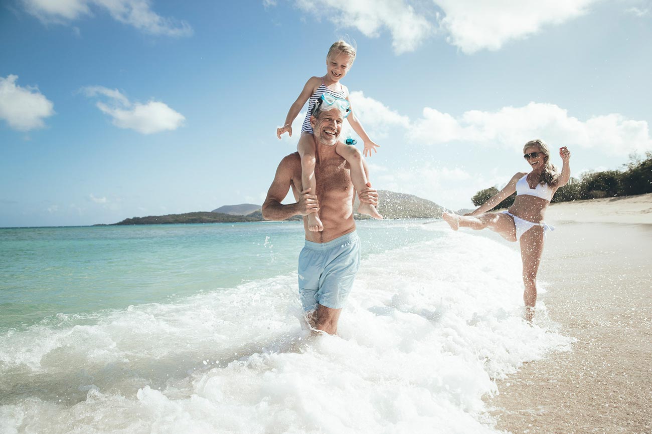 Photo of family playing on the beach